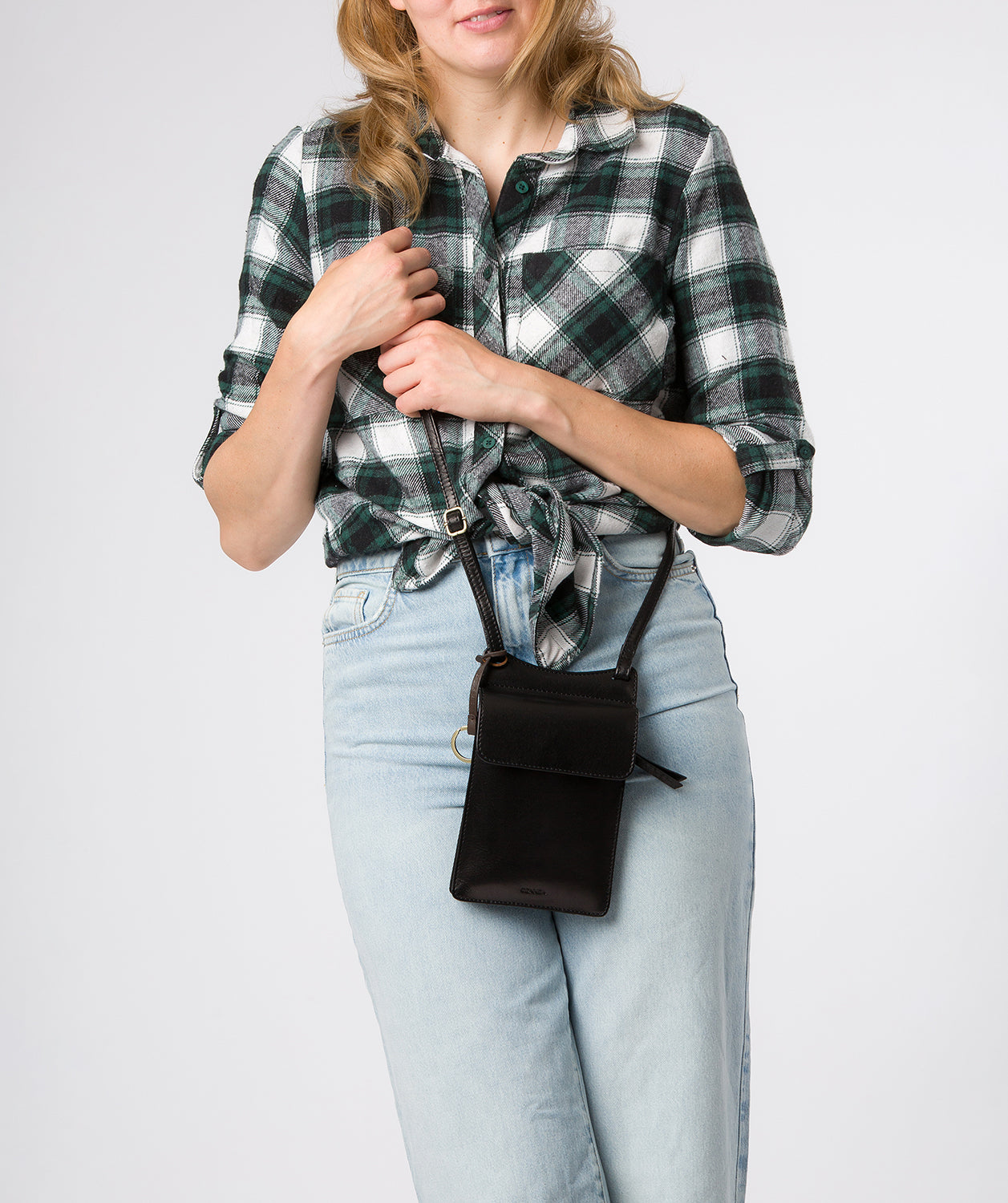 Rear zipped pocket detail and side profile of crossbody bag