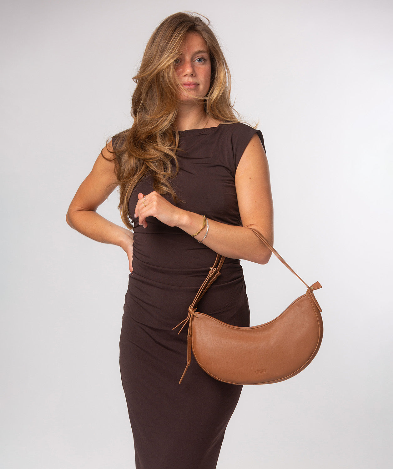 Consuelo grab bag top zip closure and crescent shape detail
