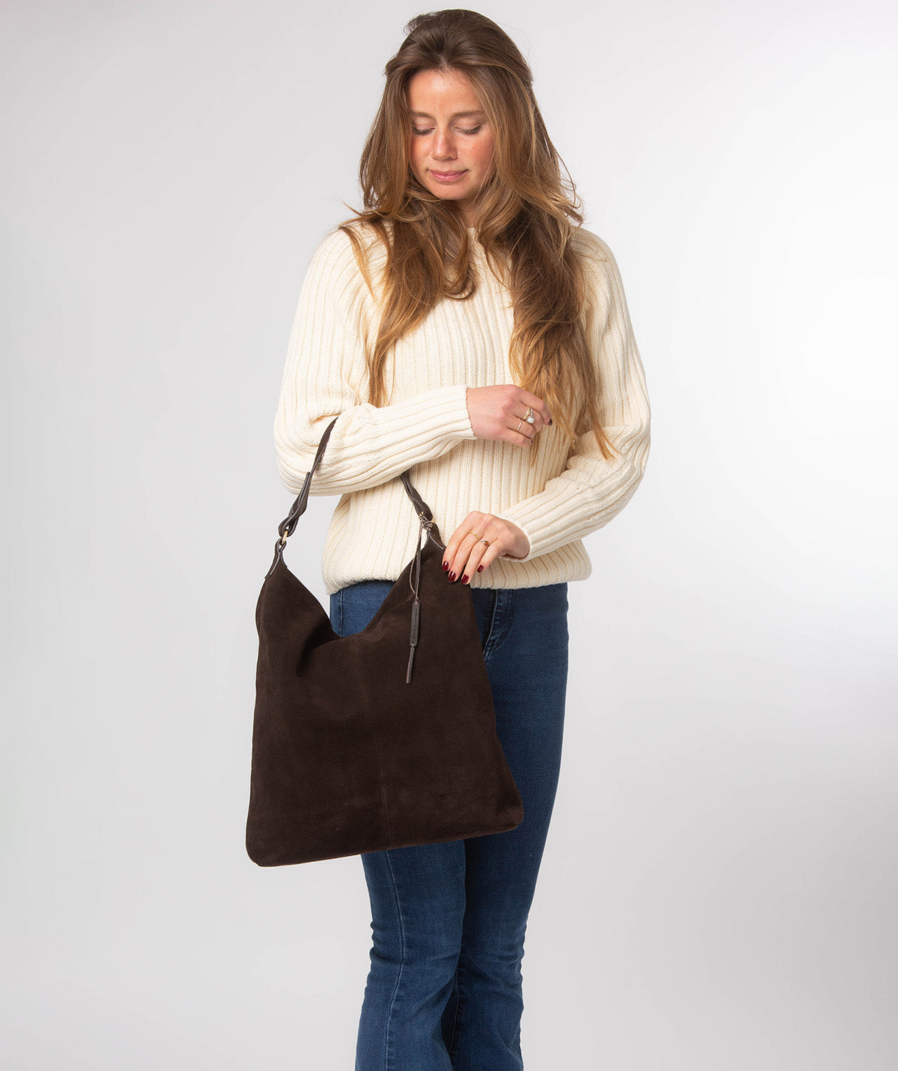 Side profile displaying slim leather carry strap