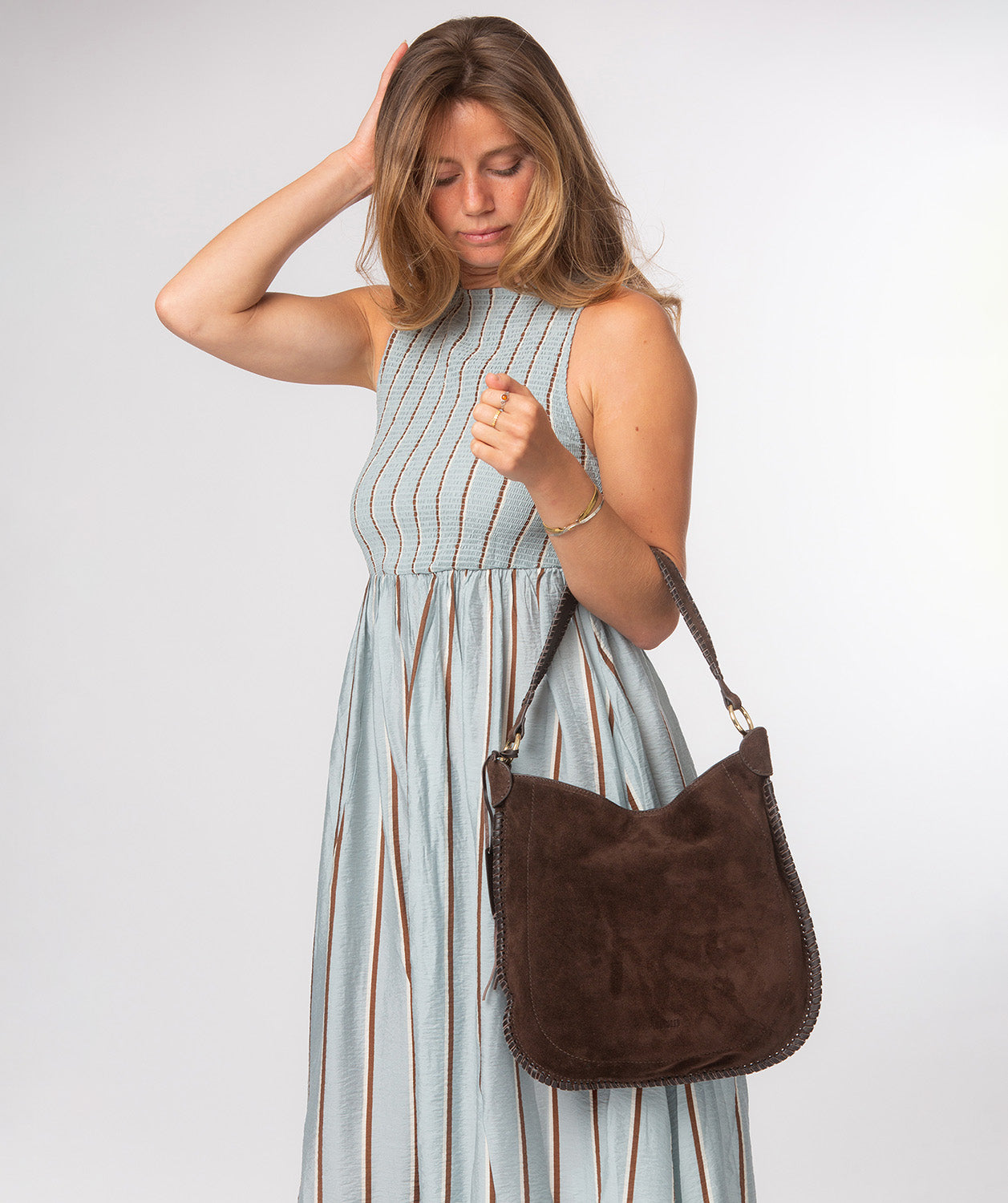 Bonnie bag side profile showing woven leather trim detail