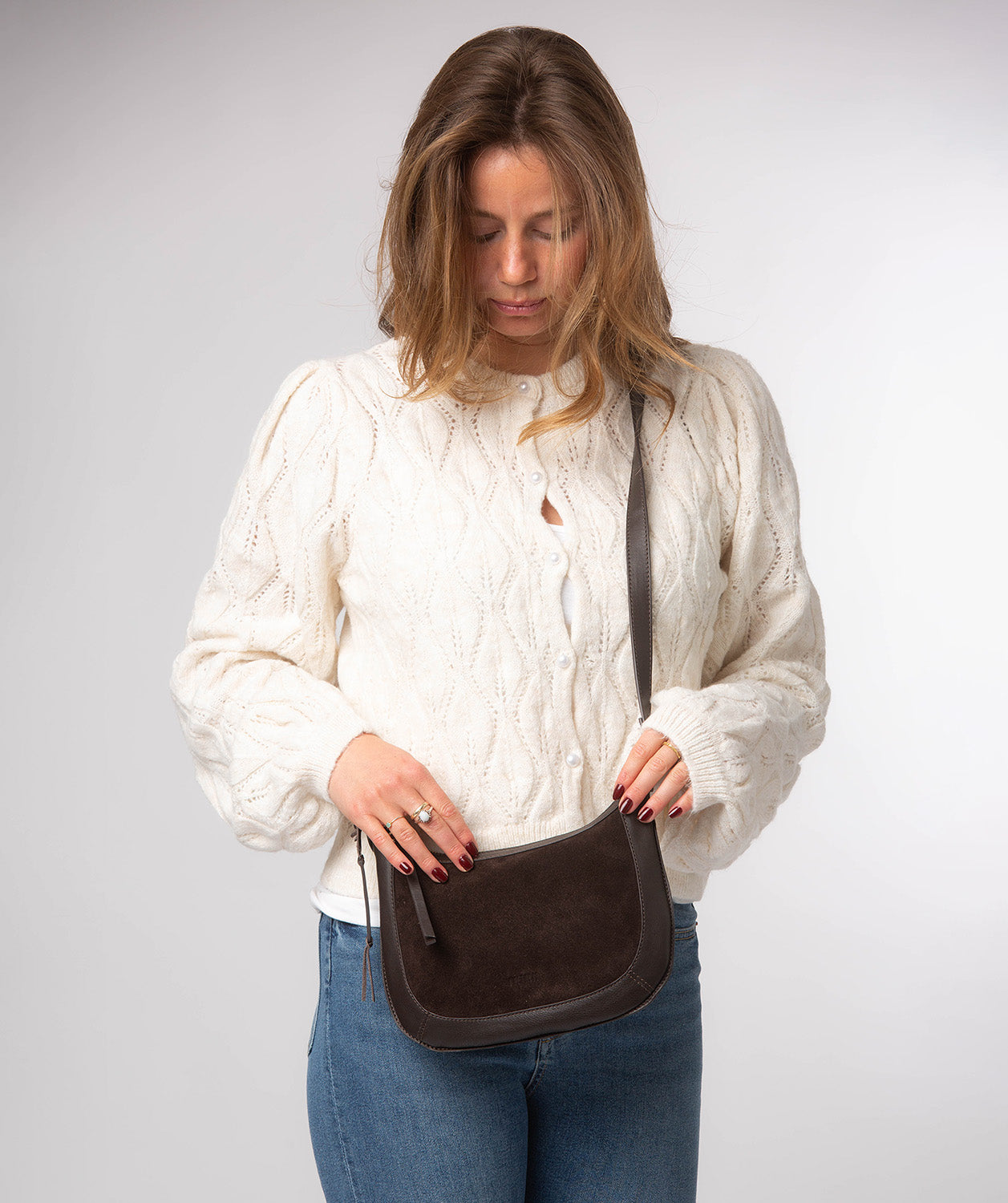 Roisin bag side profile showing leather shoulder strap