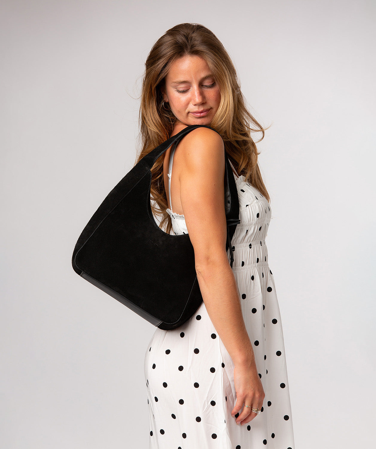 Eloise handbag side profile with leather trim detail