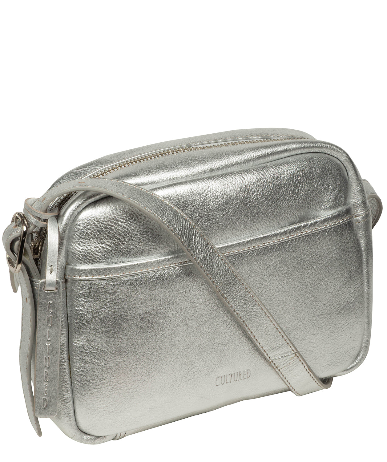 Metallic silver leather pebble grain texture close-up