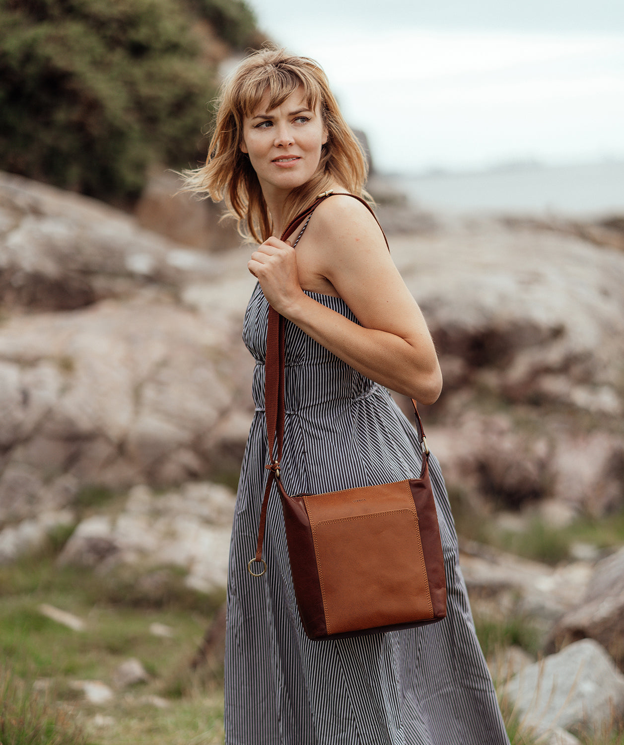 Woman wearing Indigo leather shoulder bag lifestyle photograph
