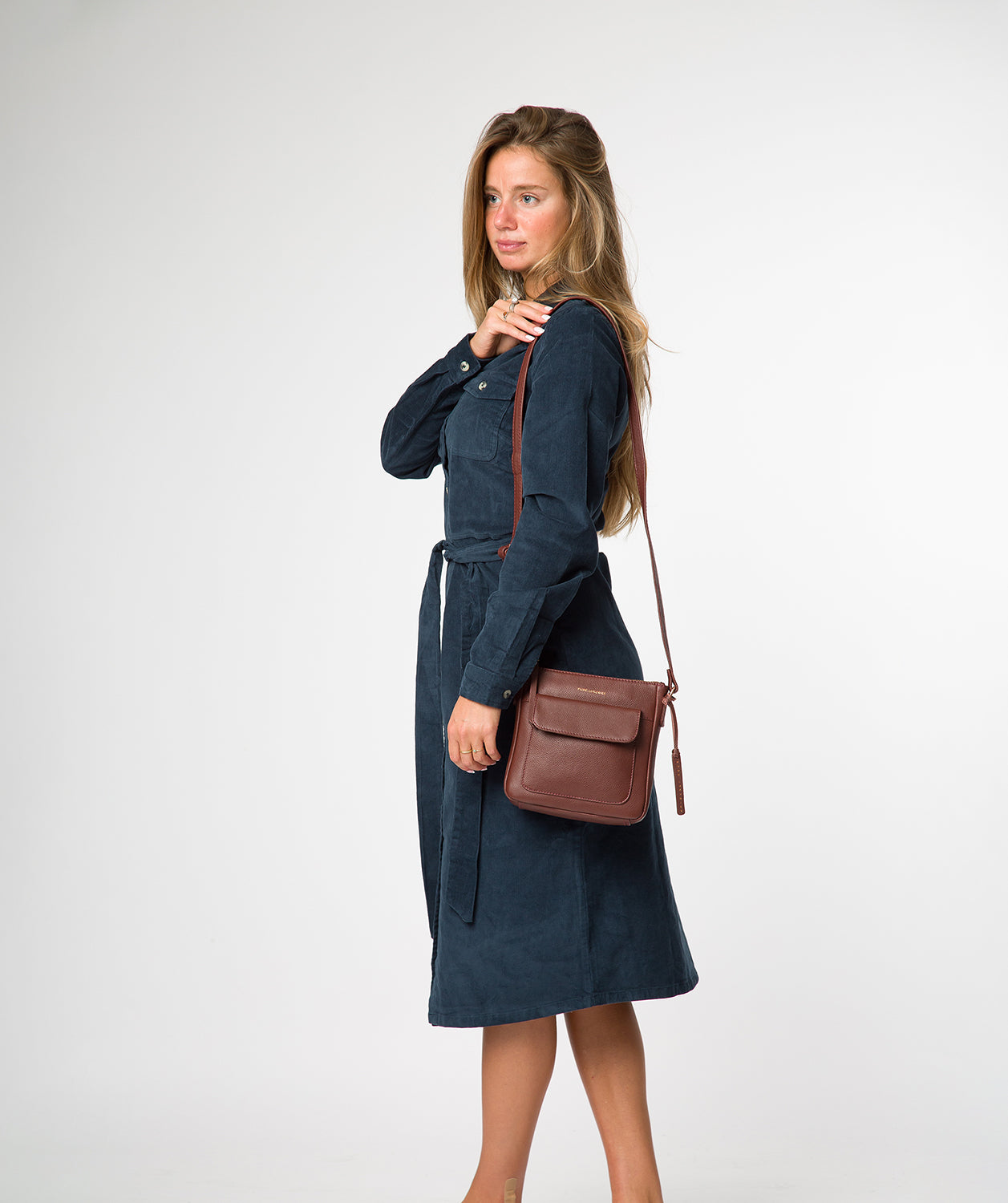 Front slip pocket with press stud and fold-over top