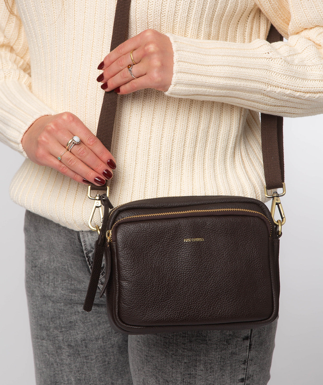 Pebble grain leather texture and embossed logo detail