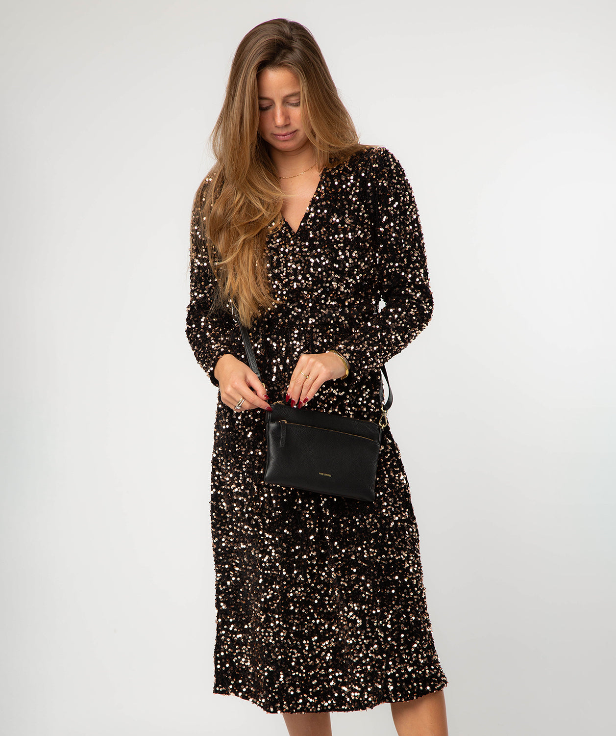 Estelle leather bag side profile with gold fittings
