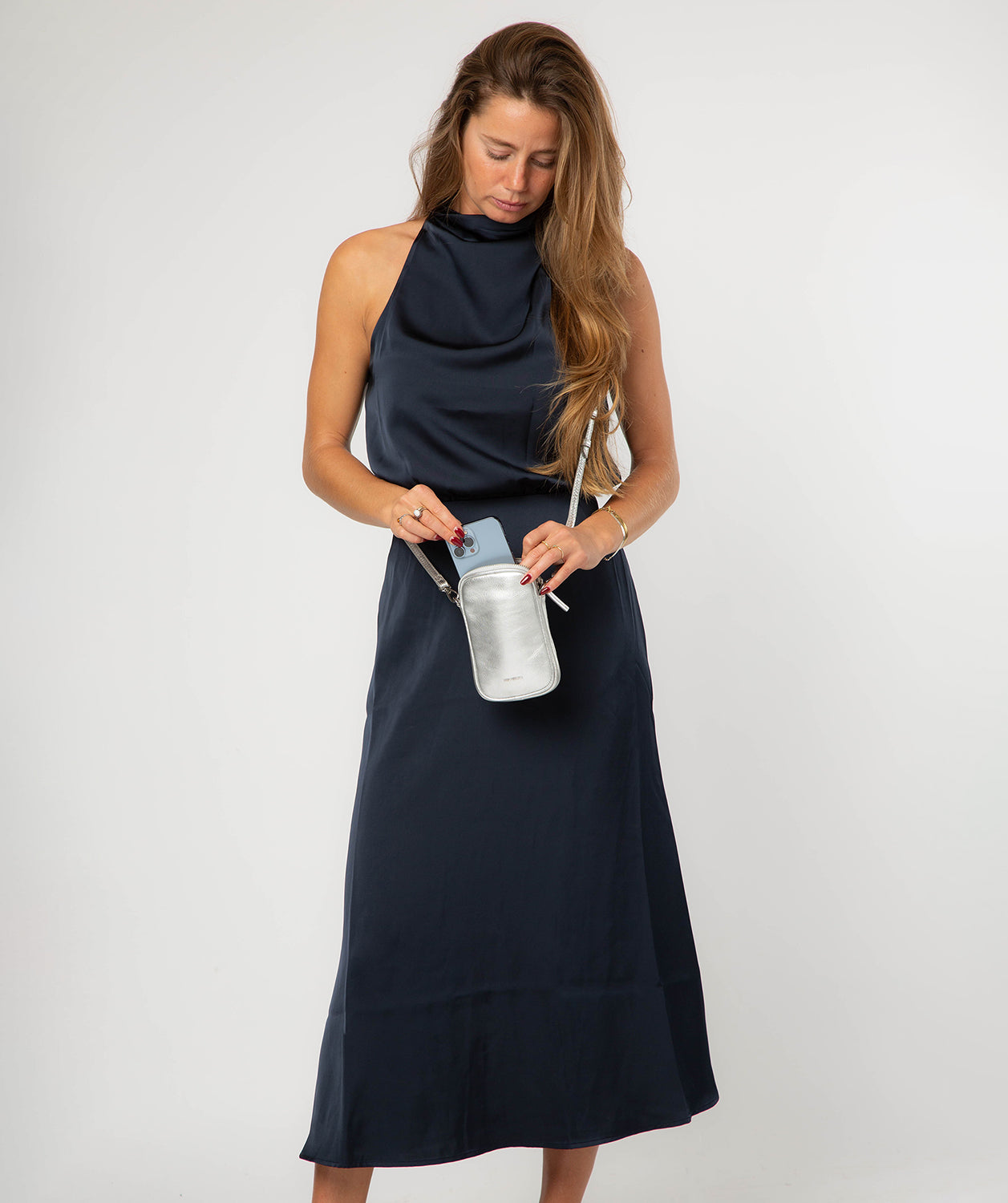 Back view showing silver hardware and structured silhouette