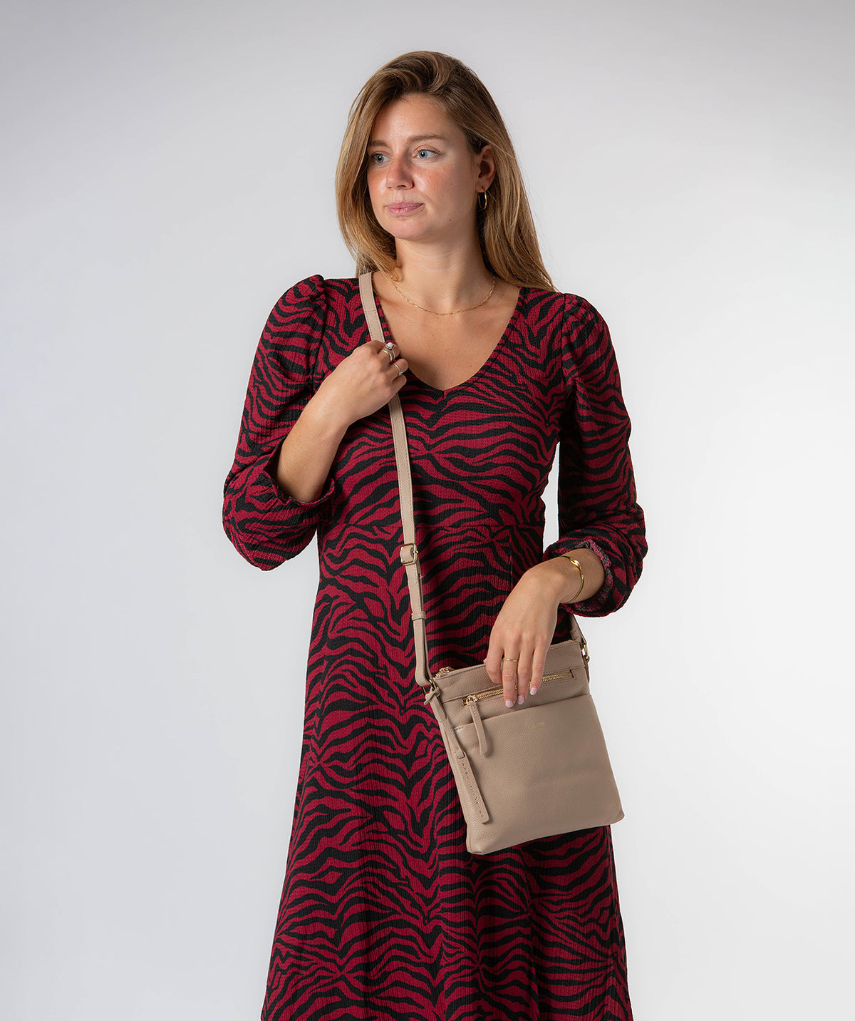 Lucero crossbody bag side profile with adjustable shoulder strap