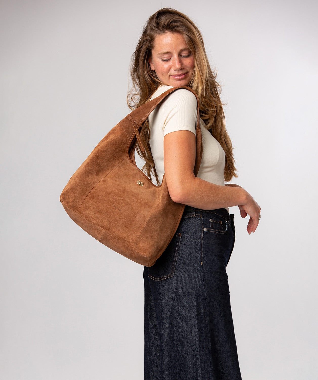 Polly bag side profile showing leather trim detail