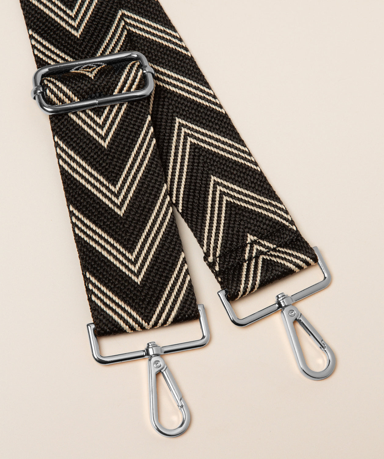 Pure Luxuries canvas chevron bag strap cream and black with silver hardware front view