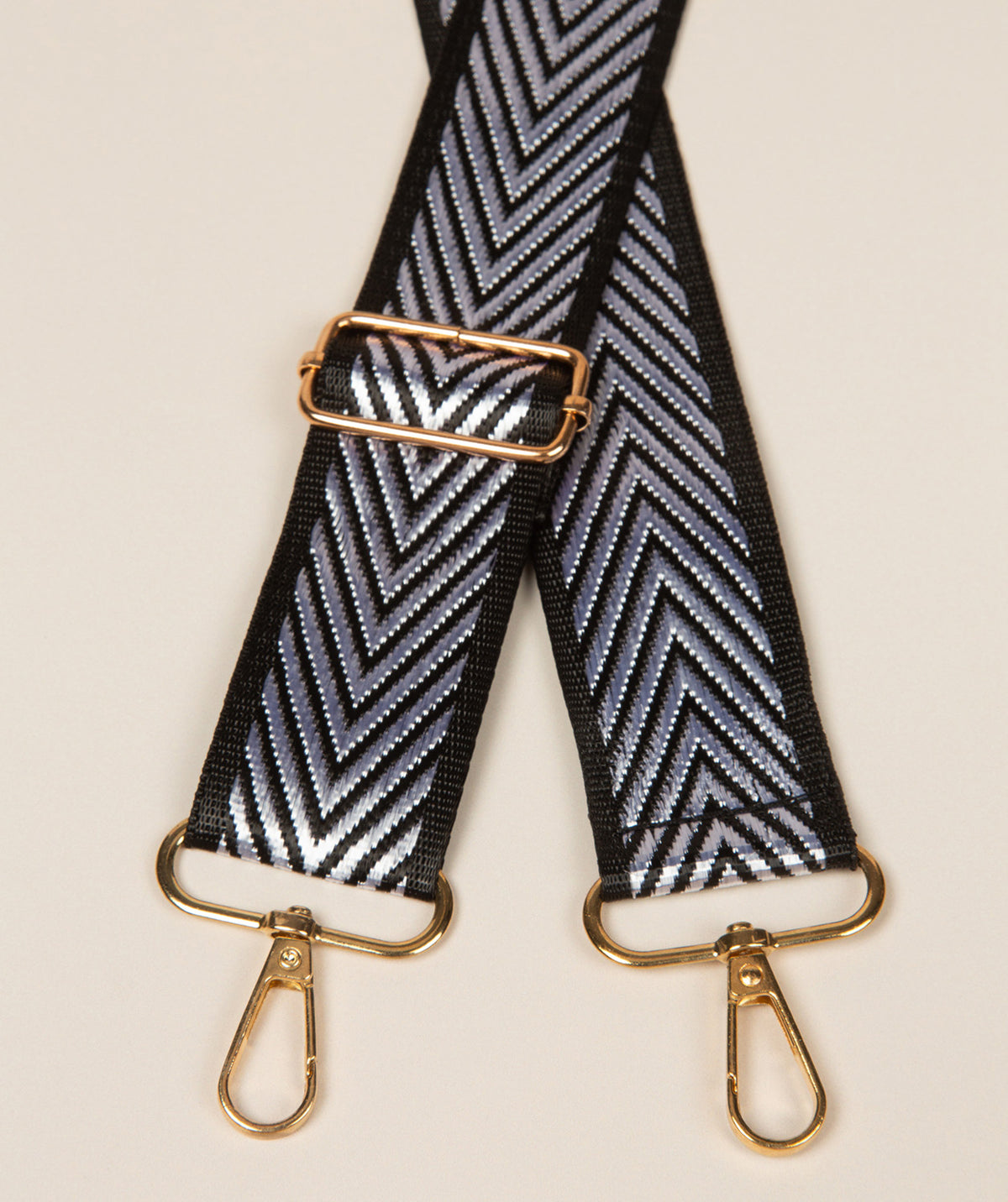 Pure Luxuries silver and black chevron bag strap with gold fittings full view