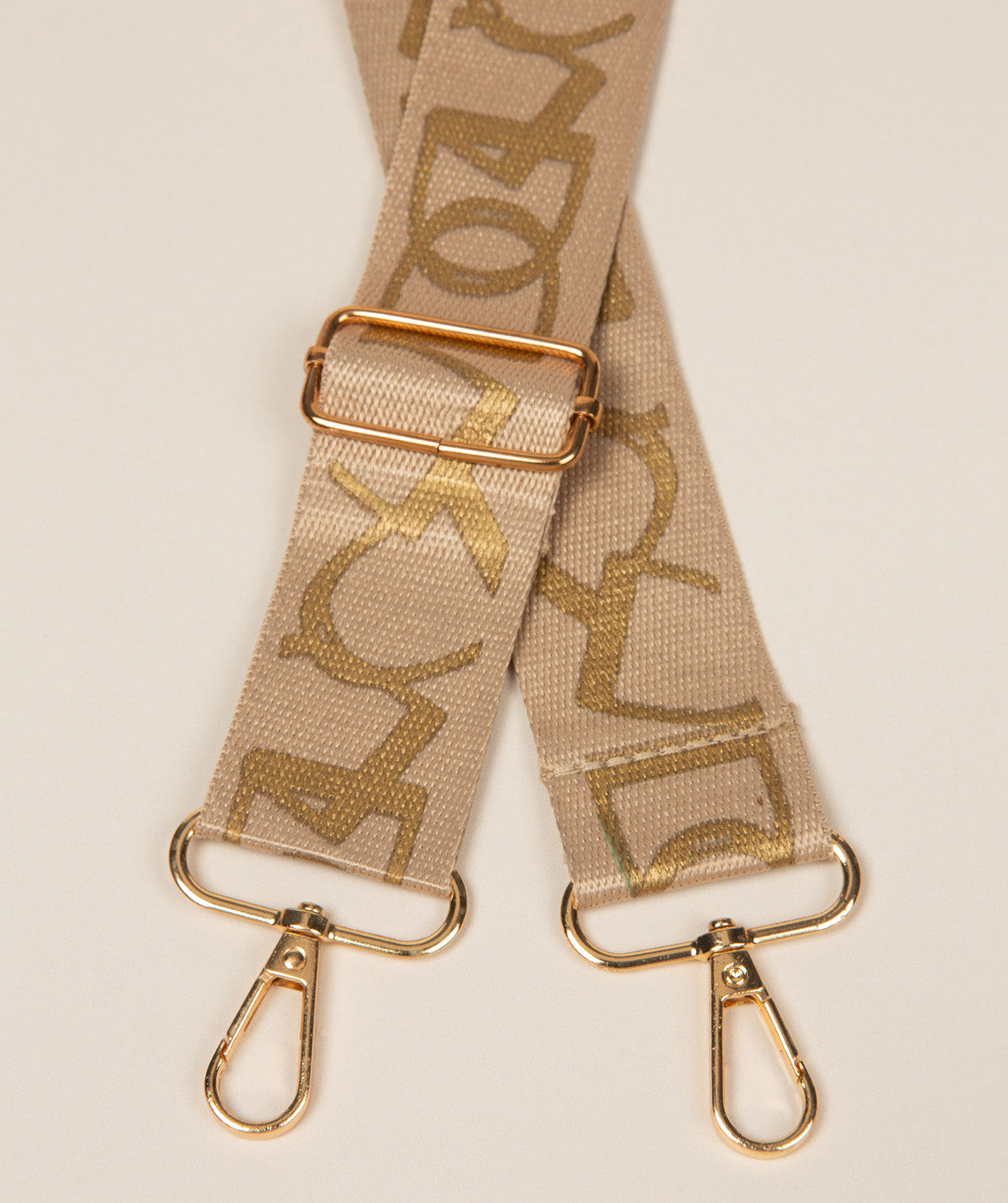 Pure Luxuries beige and gold monogram bag strap with gold fittings
