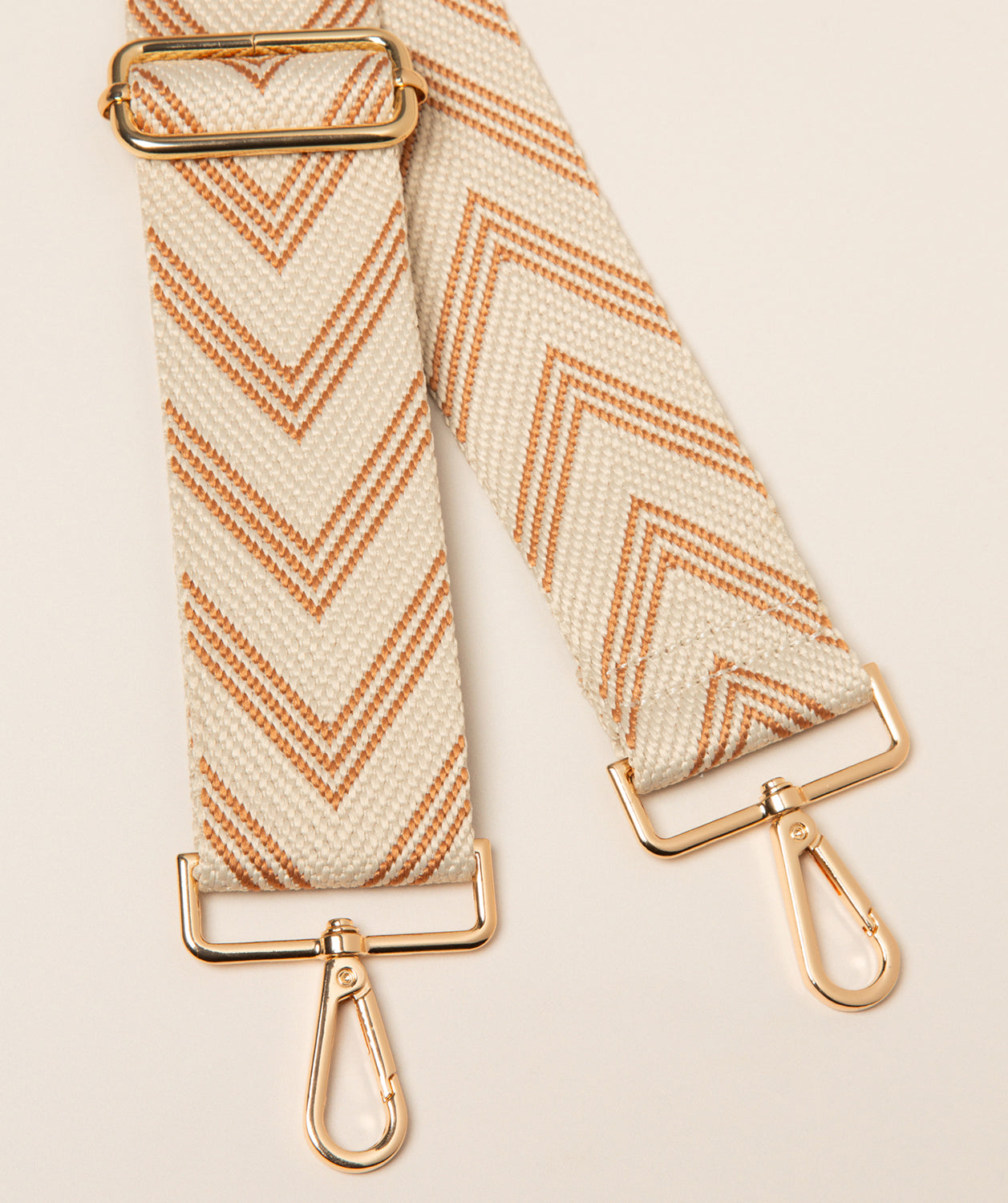 Pure Luxuries canvas chevron bag strap terracotta and cream with gold fittings front view