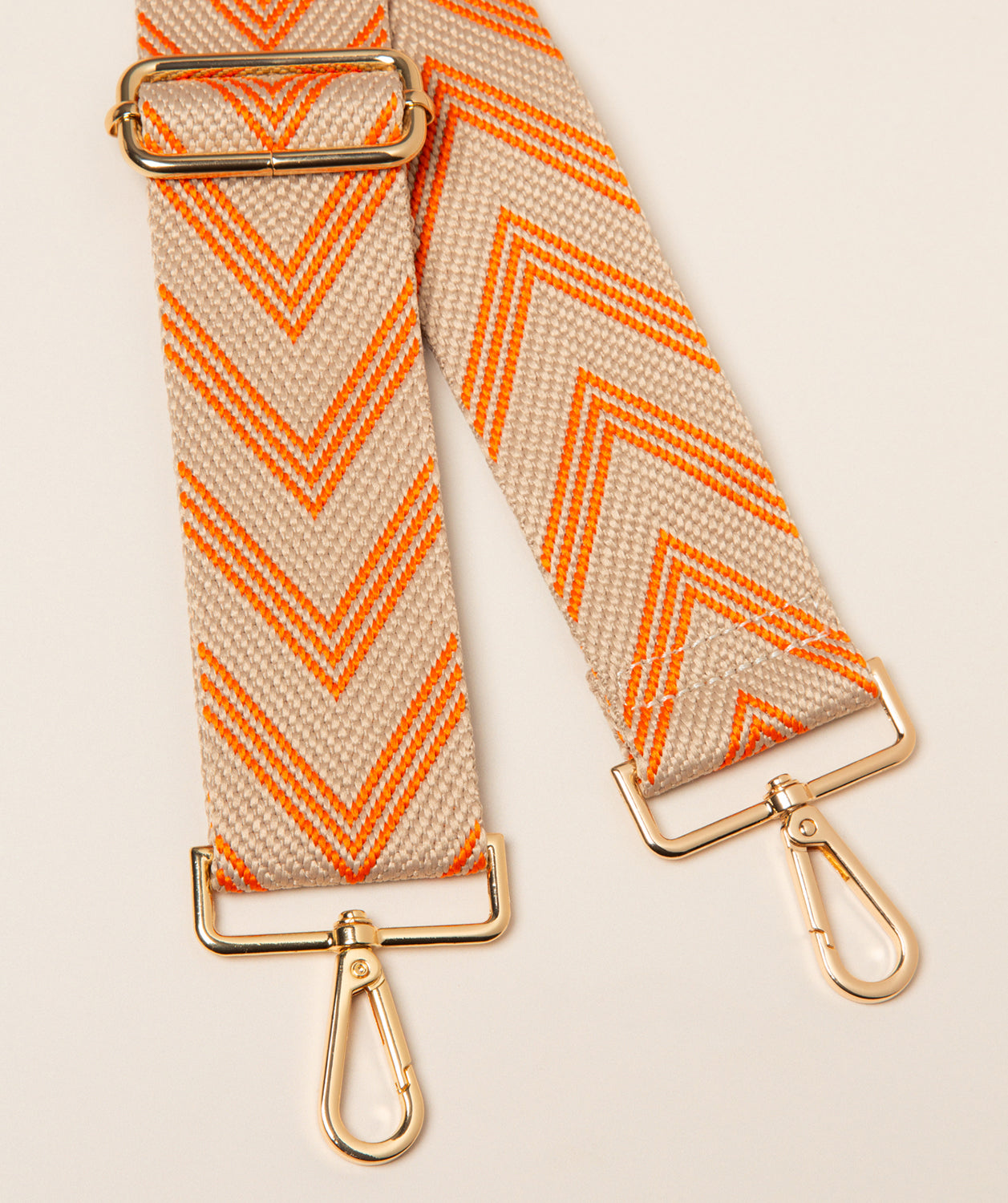 Pure Luxuries canvas chevron bag strap clementine and cream with gold hardware front view