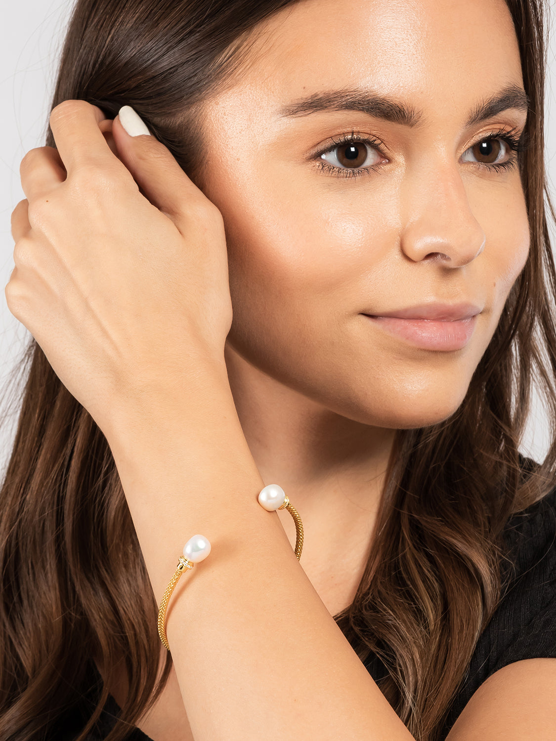 bangle worn on wrist showing pearl and cubic zirconia detail