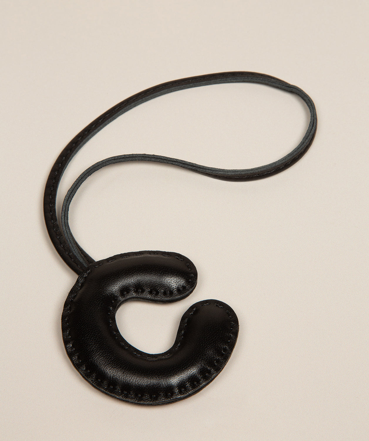 black leather letter charm with embossed C front view
