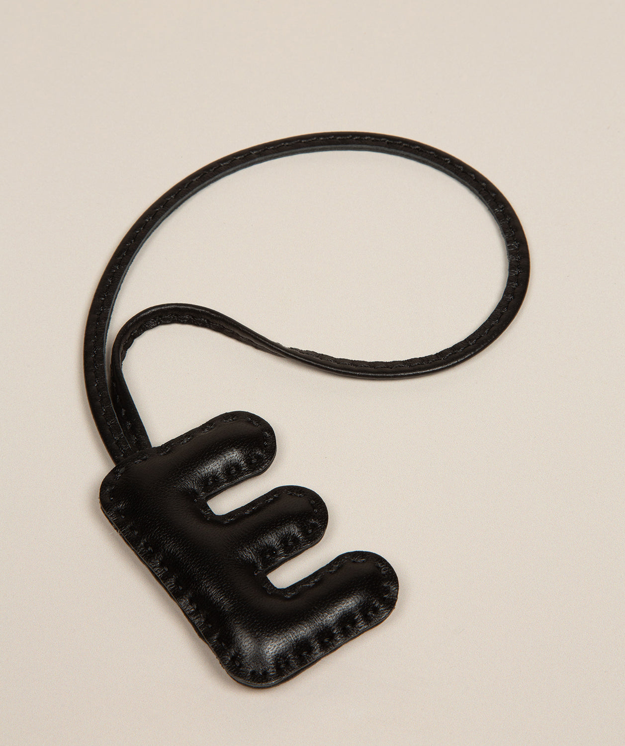 black leather letter charm with embossed E front view