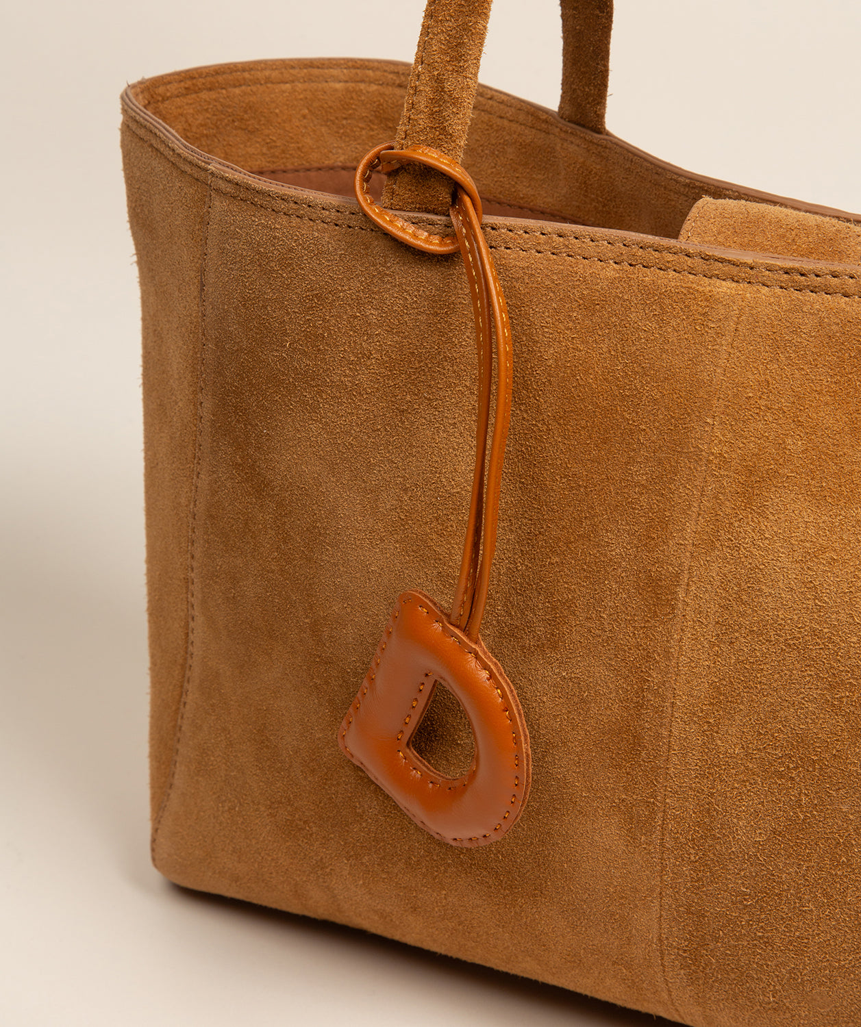 tan leather charm portable lightweight design