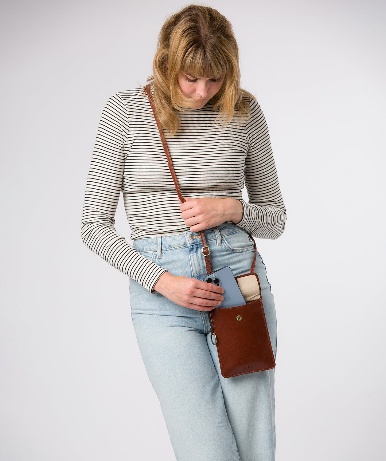 Brass hardware and leather strap detail