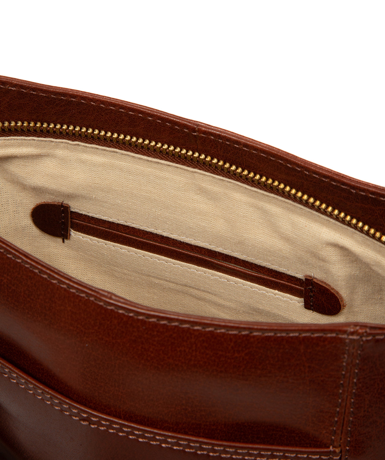 Side profile showing brass hardware and textured leather