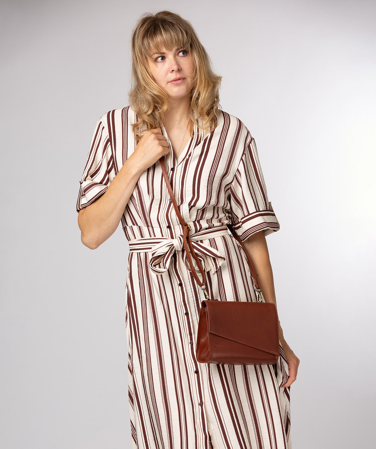 Conkca London Heron conker brown leather crossbody bag front view