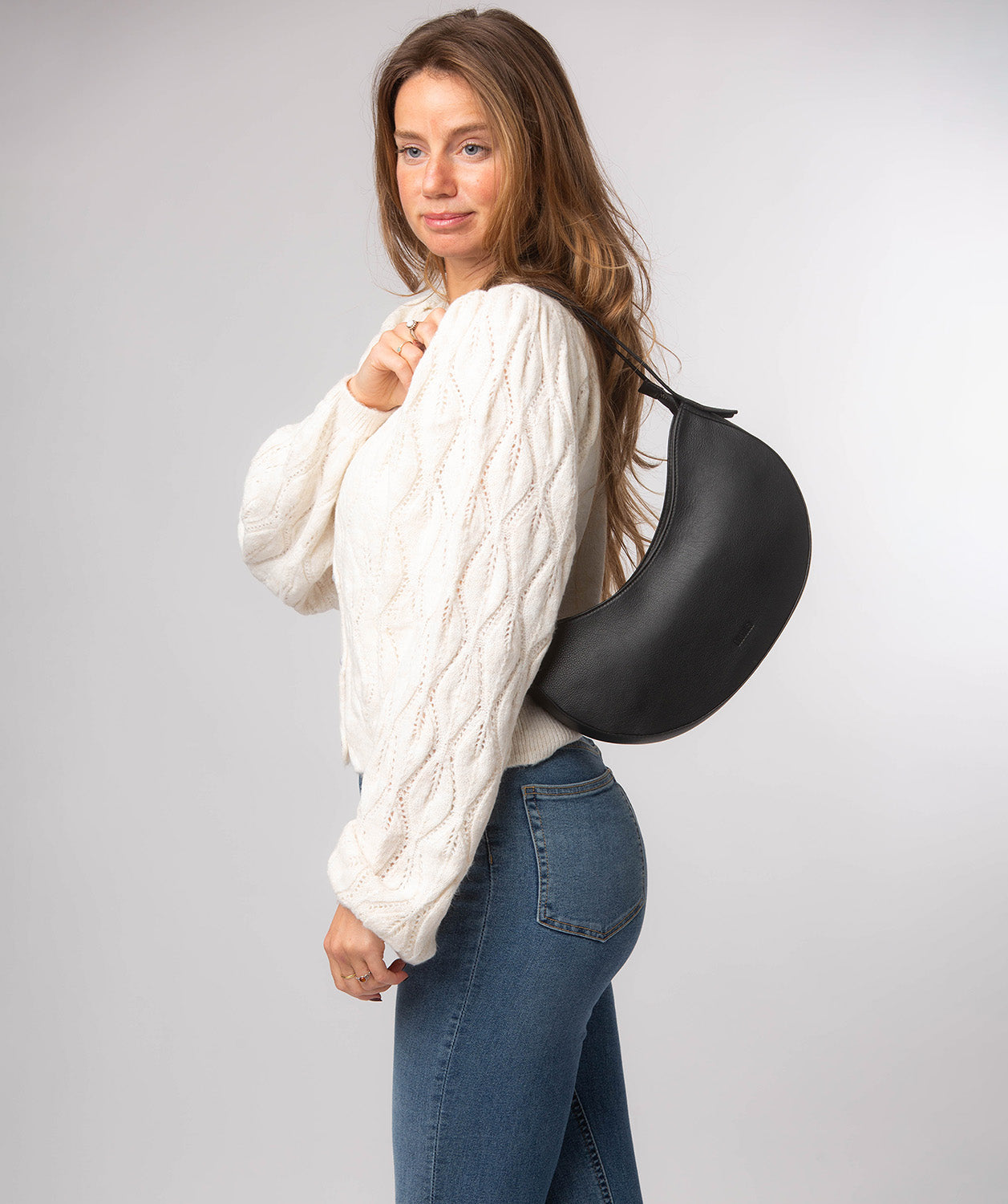 Side profile showing structured leather construction