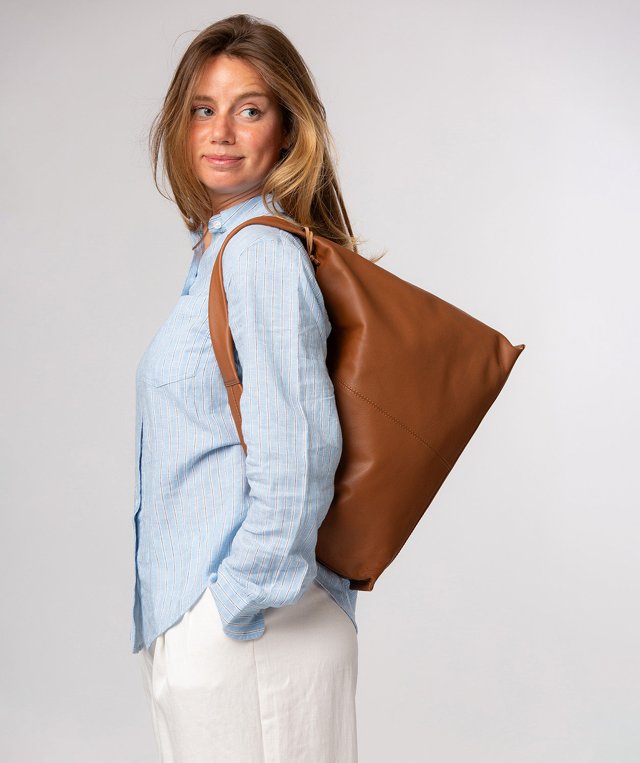 Aspen tote bag magnetic fastener and blind embossed logo detail