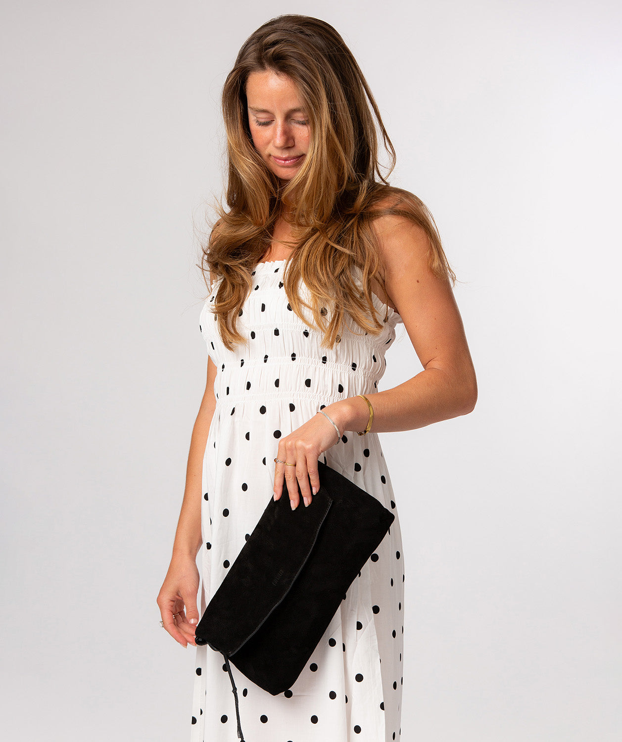 Side profile revealing slim elegant fold-over silhouette
