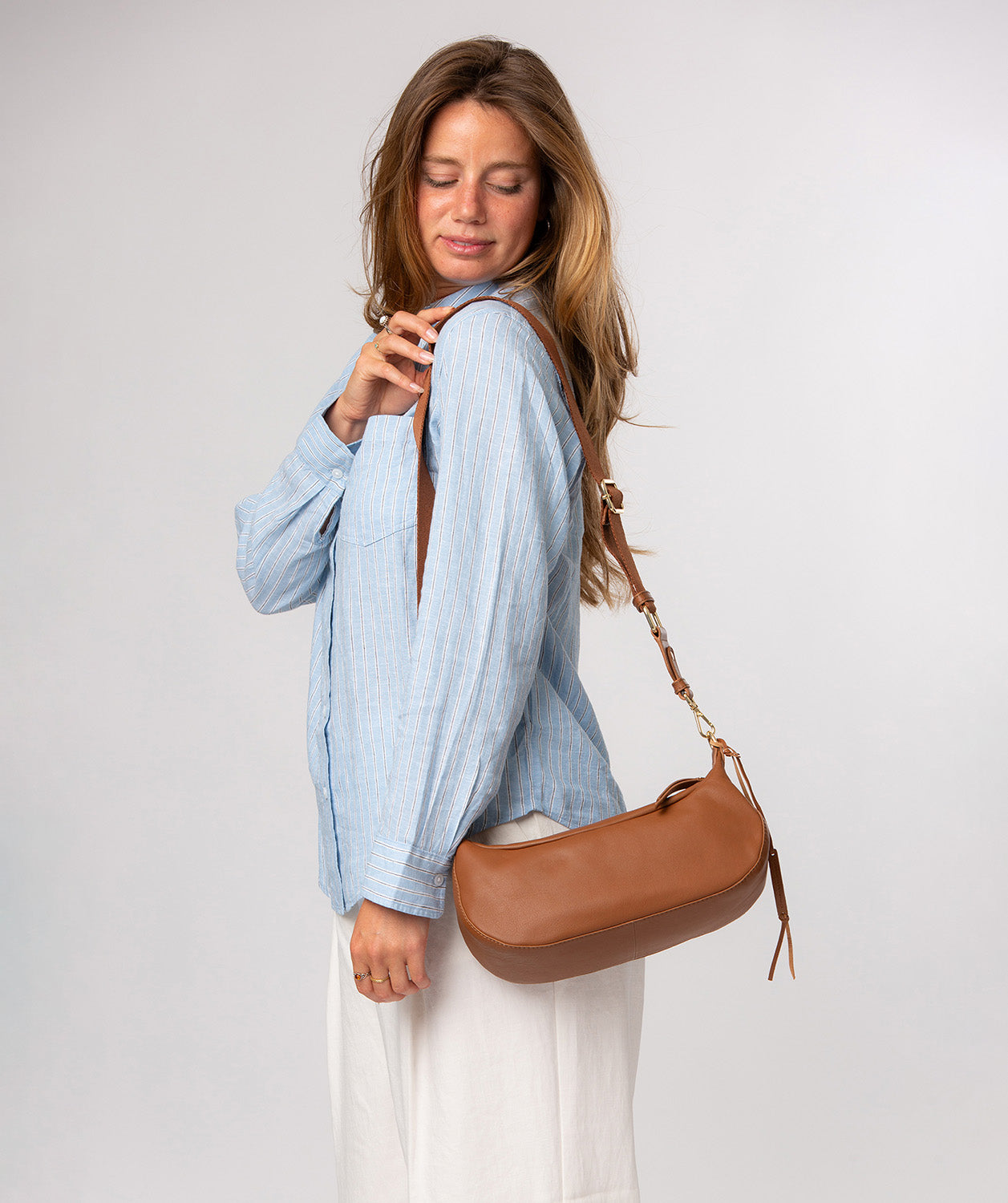 Nuala crossbody bag side profile with adjustable canvas strap
