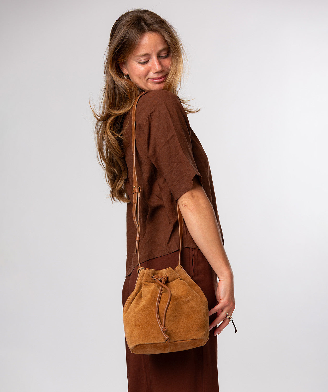 Adjustable leather strap with stud holes detail