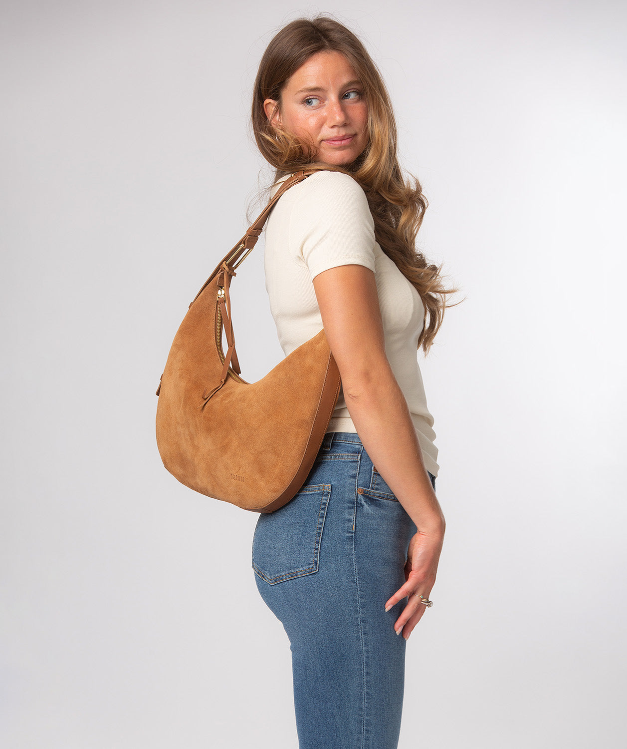 Kacey shoulder bag side profile showing adjustable strap