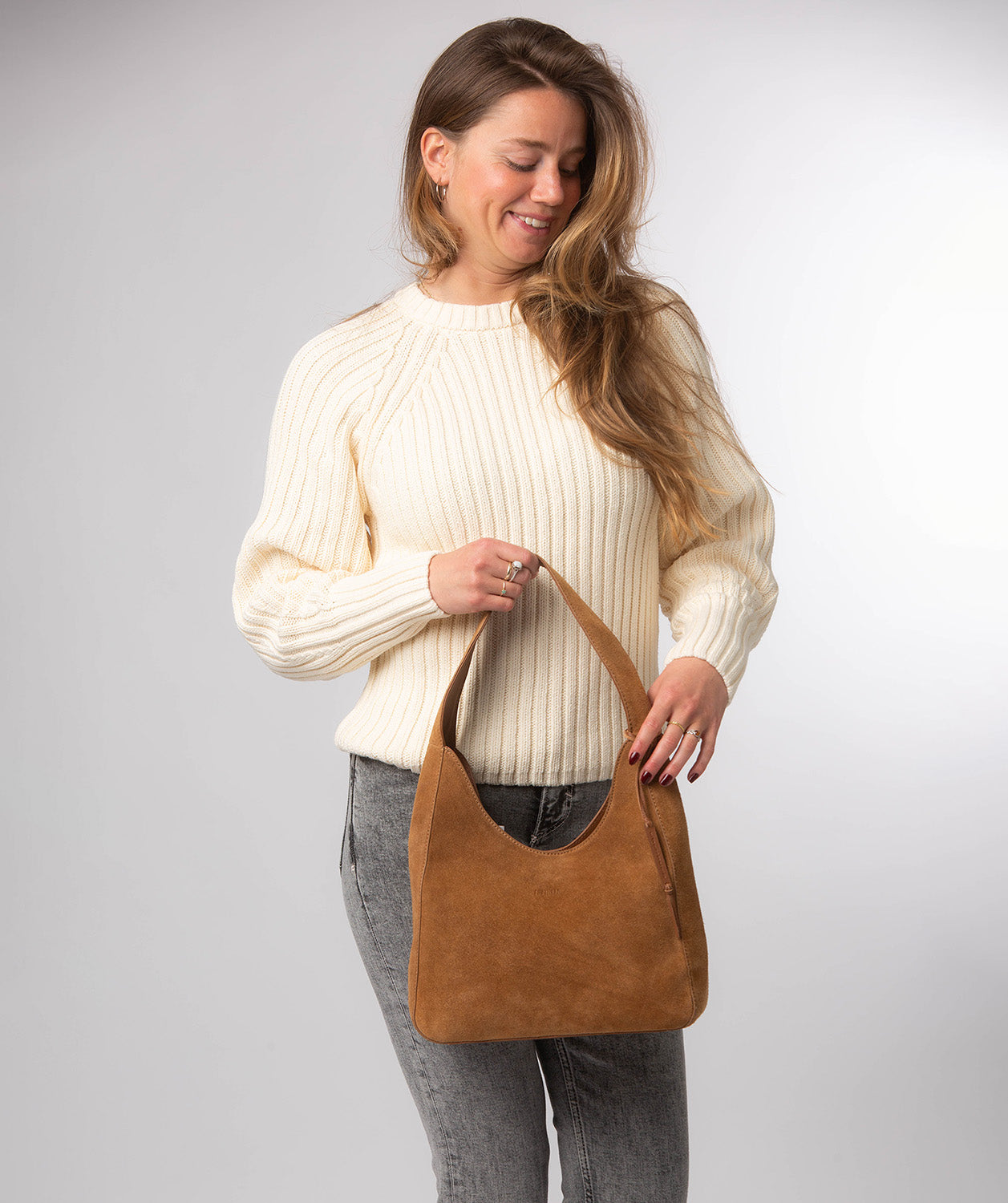 Eloise tan suede handbag three-quarter angle view