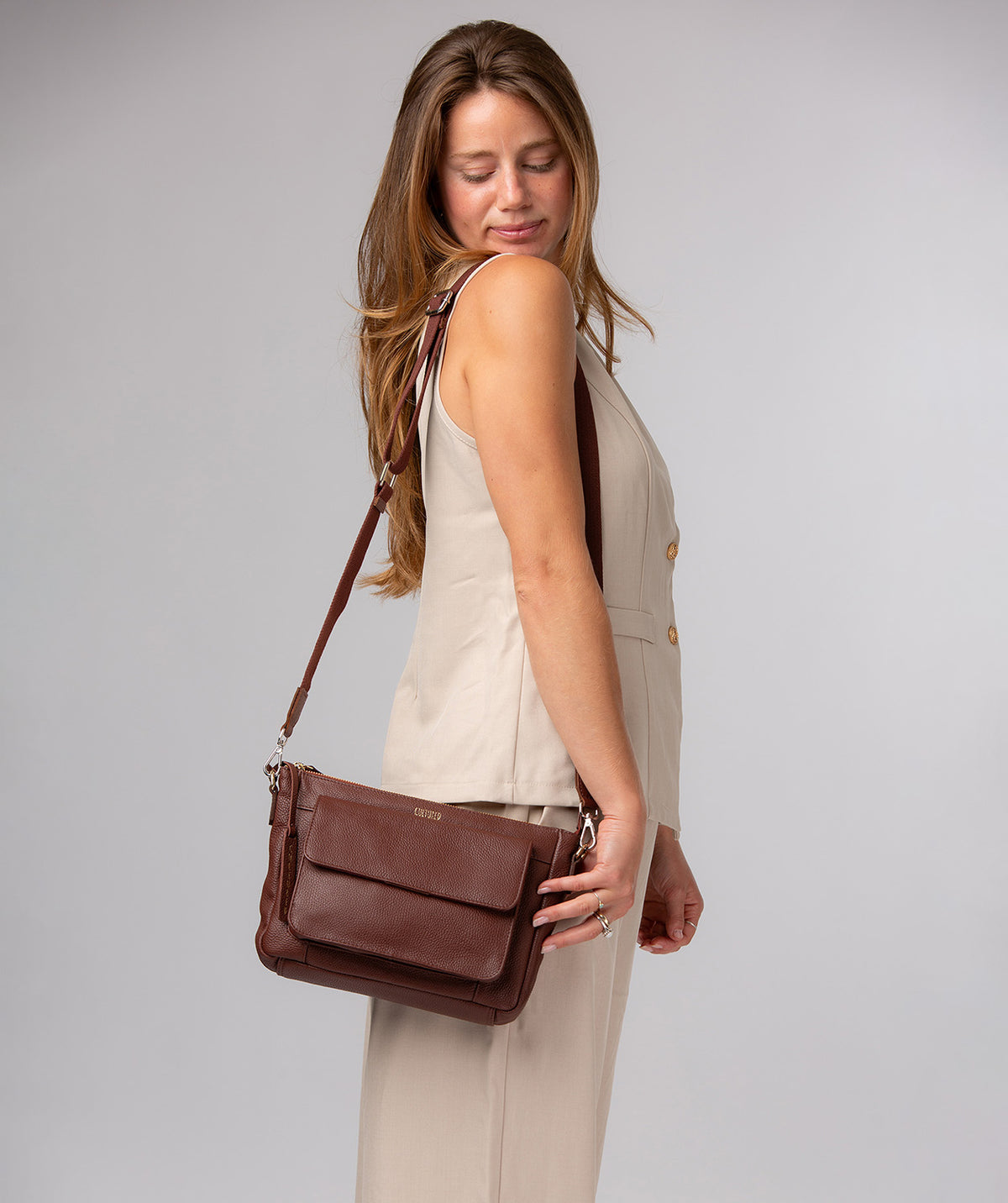 Rear slip pocket and gold-tone hardware detail