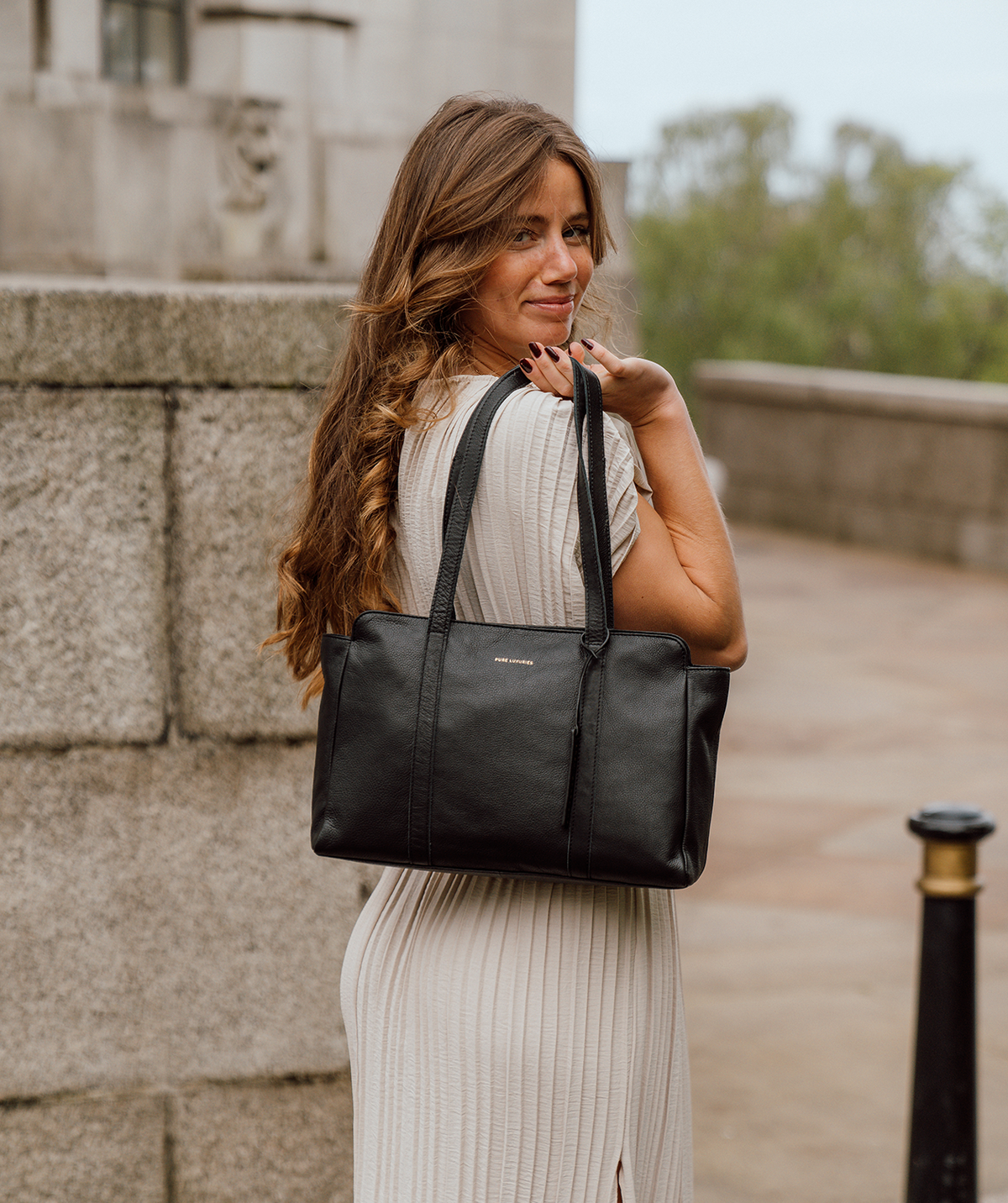 Black leather handbag styled with casual outfit