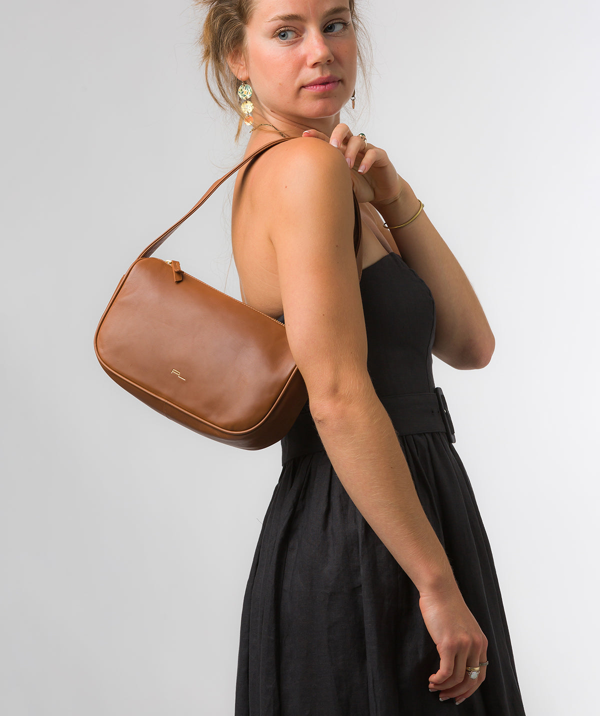 Alicia grab bag side profile with brass hardware details