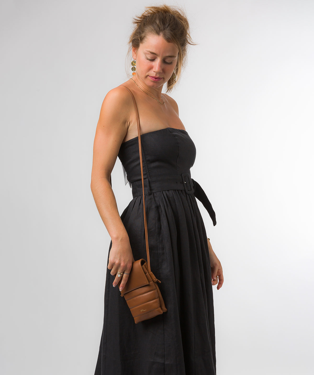 flat lay overhead view of compact crossbody bag