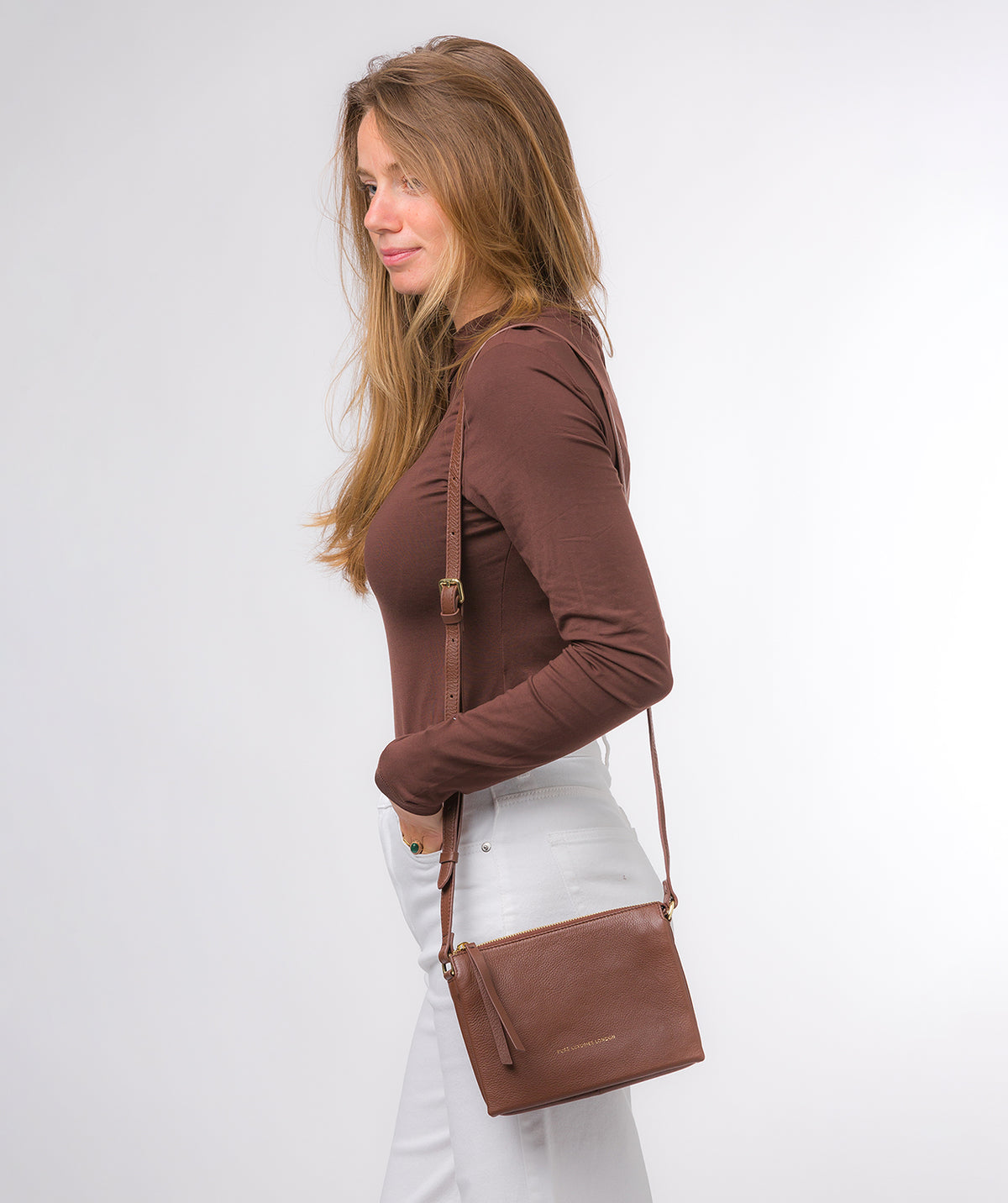 Niki crossbody bag side profile showing supple leather texture