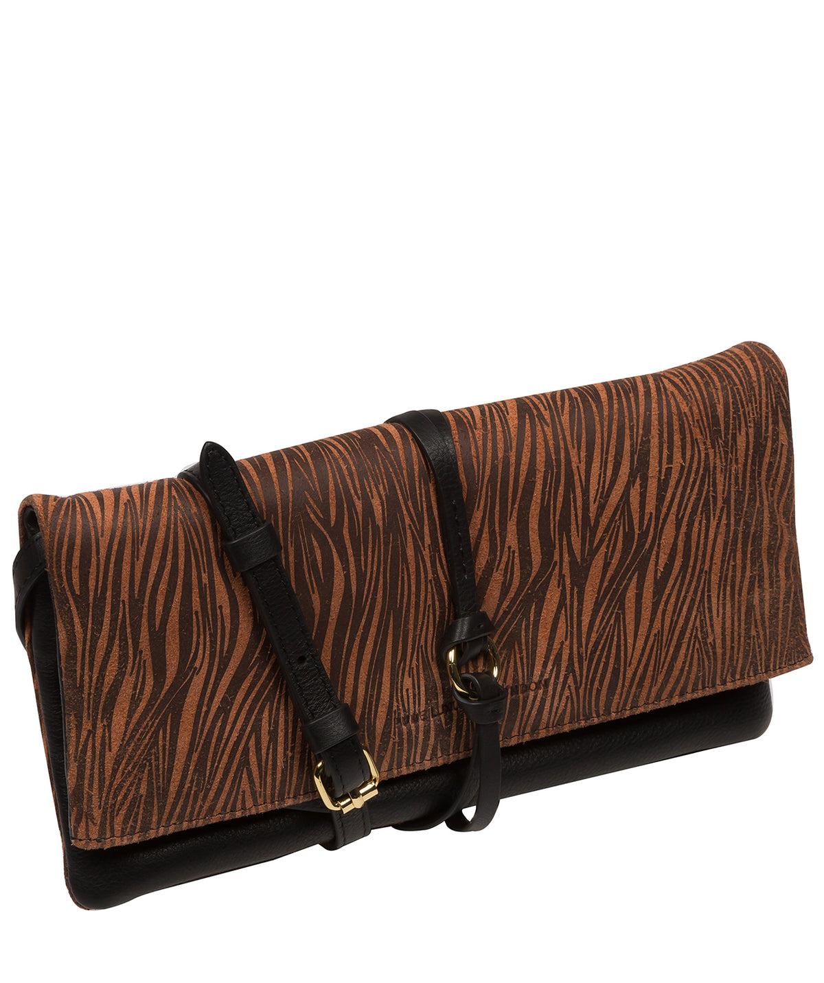 Embossed Pure Luxuries logo on suede animal print exterior