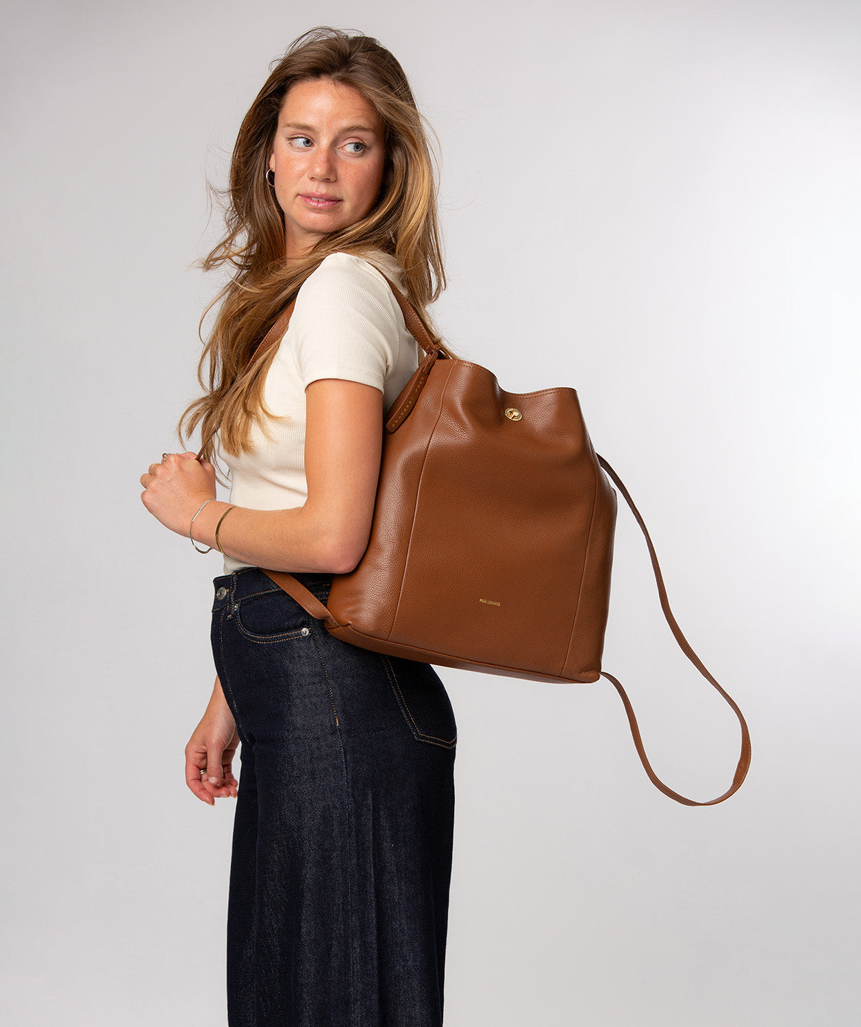 Full backpack carry position with convertible straps
