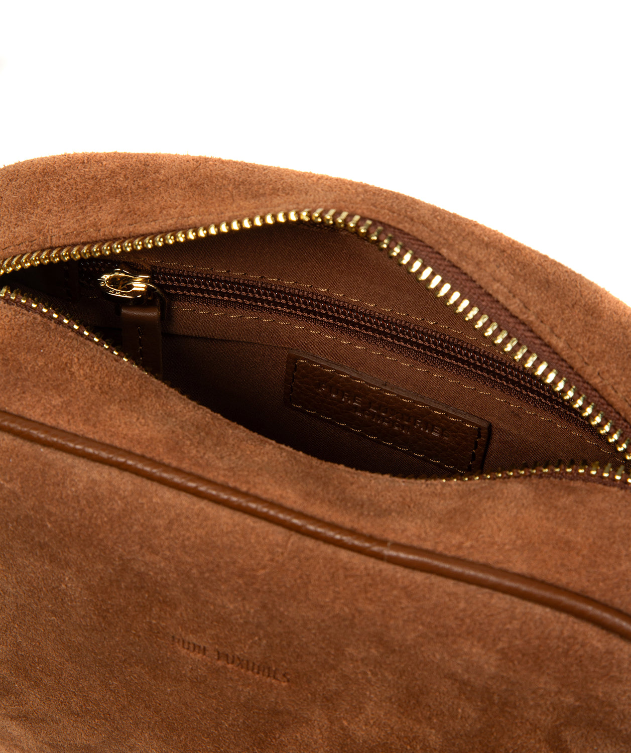 Gold-coloured metal zip and fittings on Fable crossbody bag