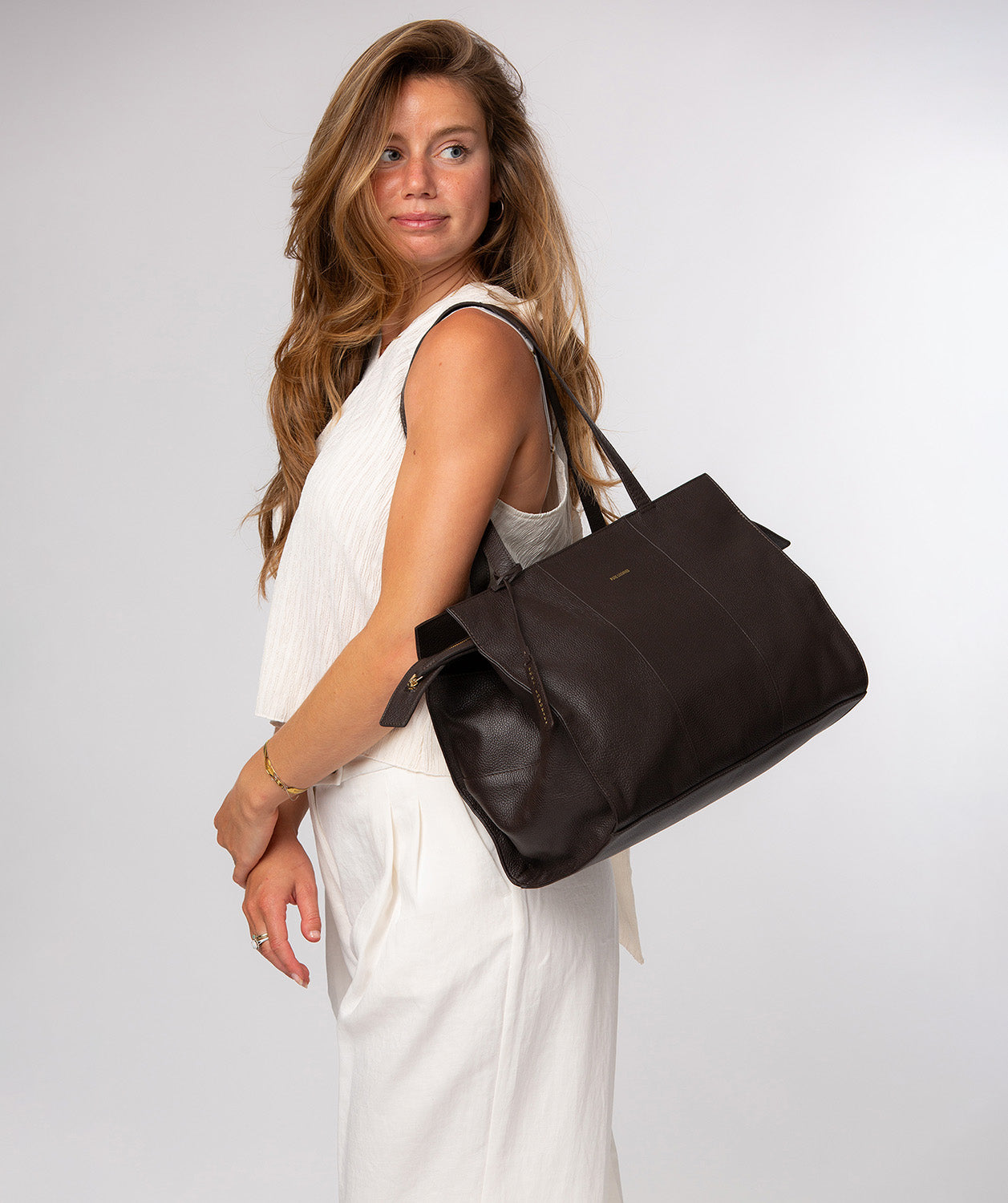 Elinor tote bag back view showing gold foil logo