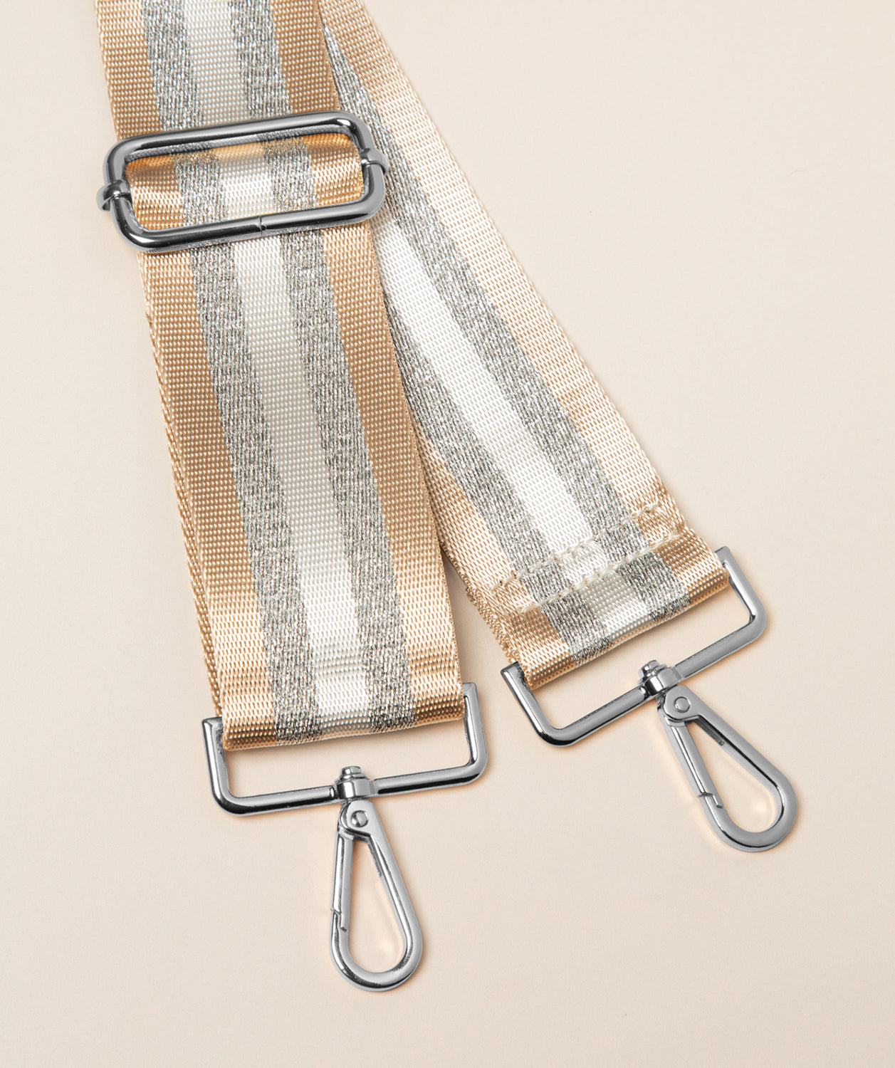 Pure Luxuries champagne and silver striped canvas bag strap with silver hardware