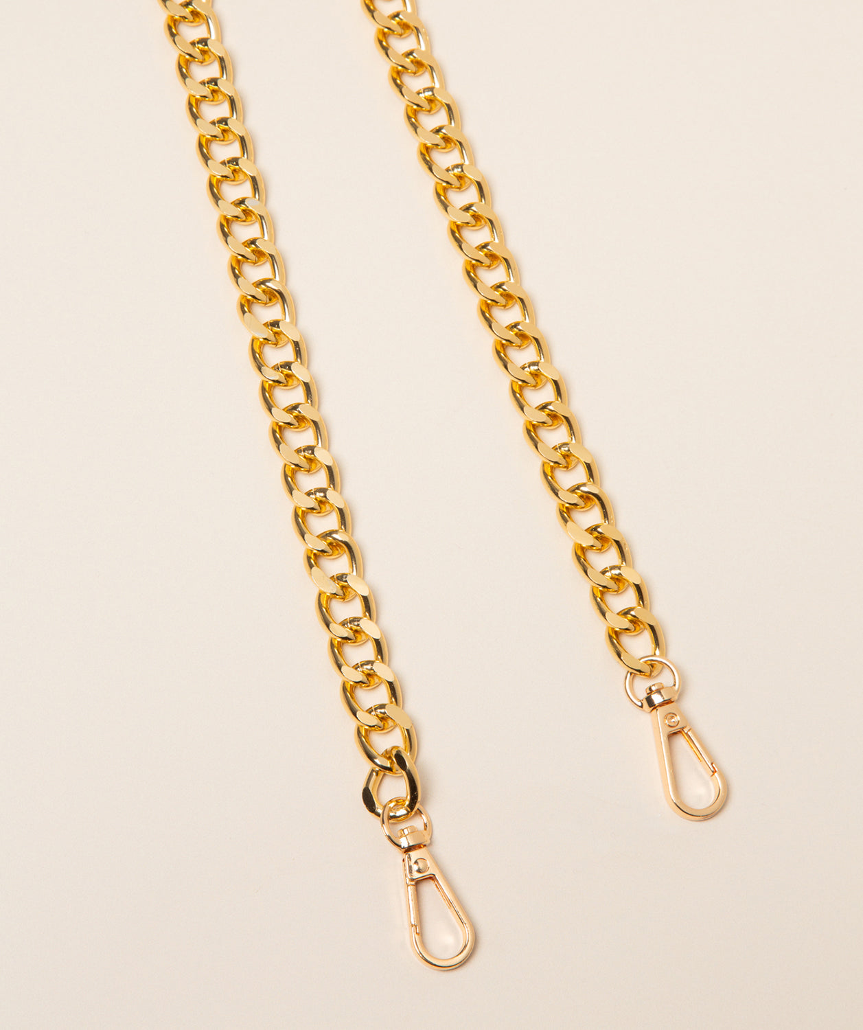 Pure Luxuries gold curb chain bag strap front view