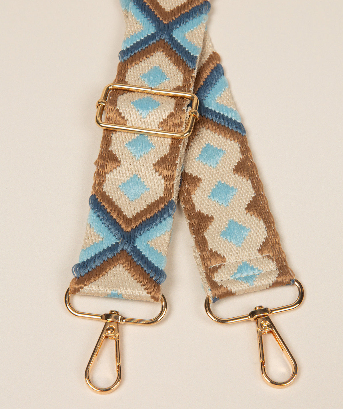 Pure Luxuries Aztec Mix bag strap with blue brown and beige pattern gold fittings