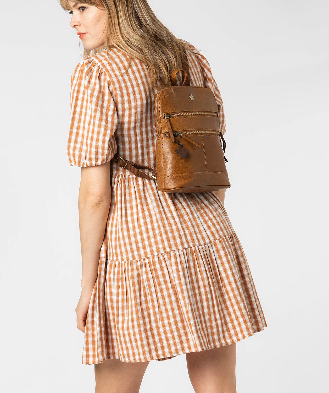 Francisca backpack side profile showing leather texture and tonal variation