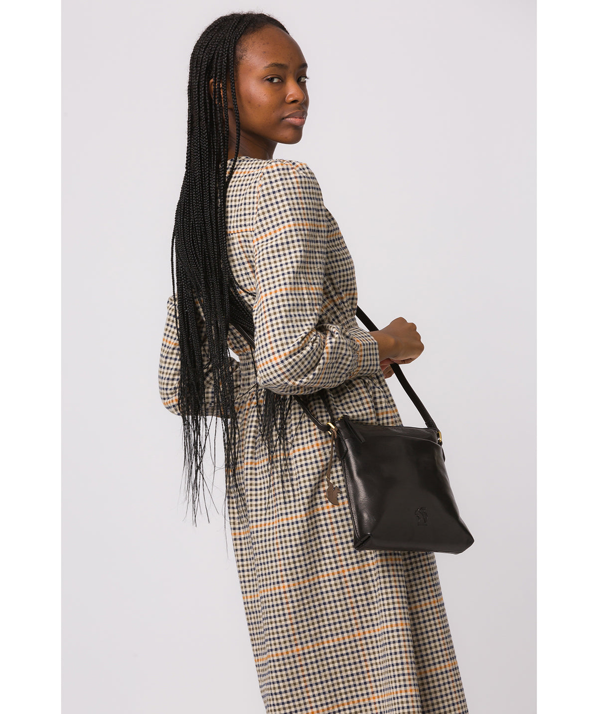 Conkca London Nikita black leather crossbody bag front view